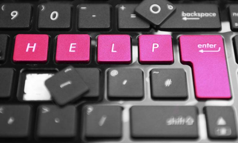 A keyboard highlighting the word Help. Helping is what virtual assistants do for their clients.